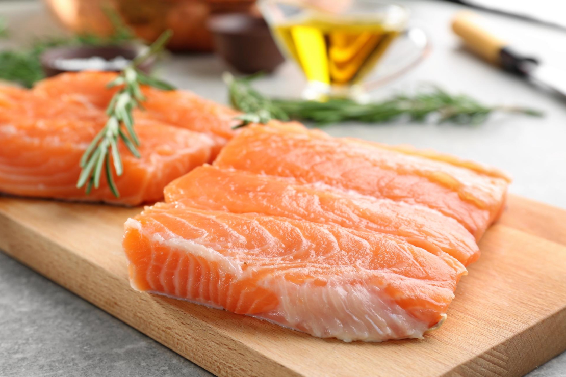 Grilled salmon fillet with lemon and herbs, symbolizing a healthy, protein-rich meal.