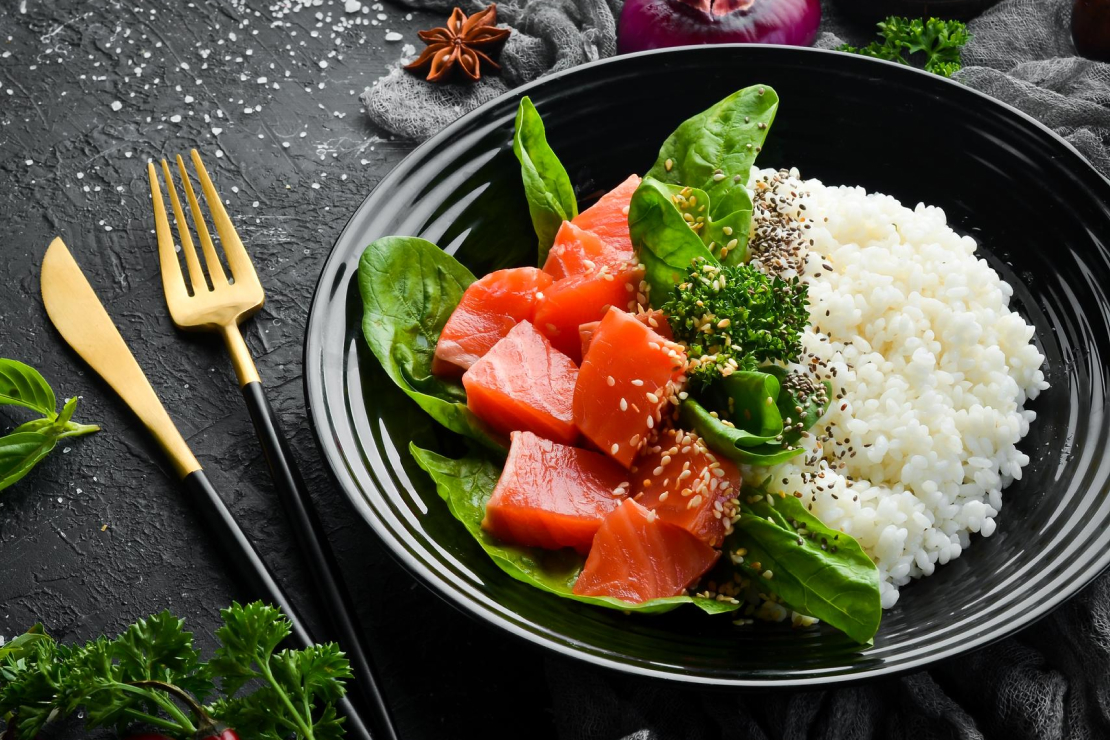 Canned tuna mixed with white rice in a meal prep container, a classic bodybuilding meal