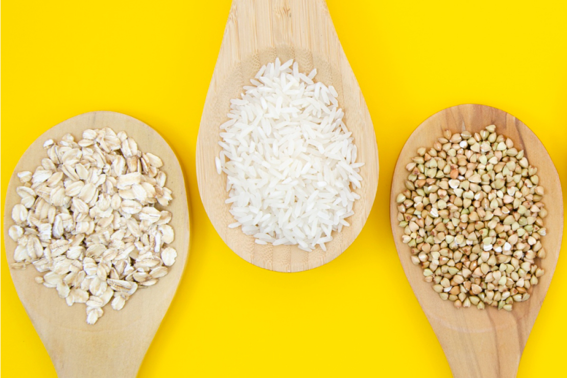 A comparison of quinoa, rice, and couscous in bowls showing their distinct textures and colors